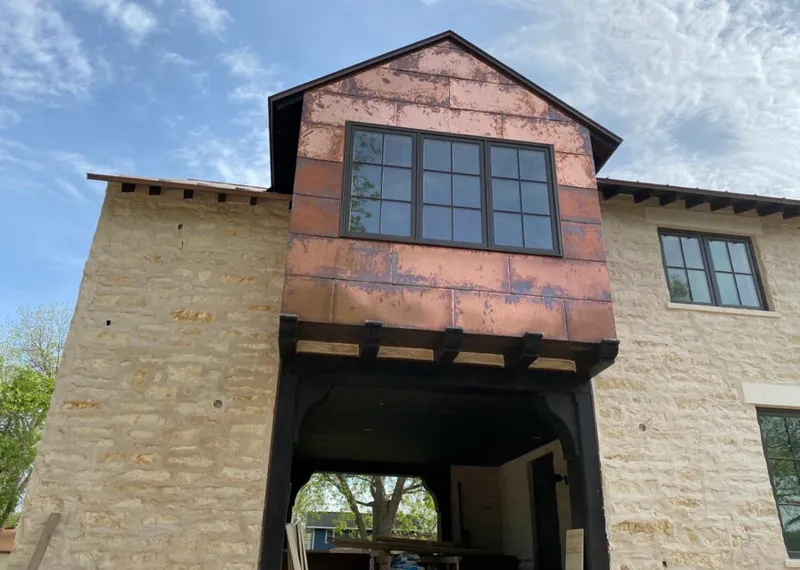 Copper metal panel facade on a stone building for Metal Roof Coating in Gardnerville